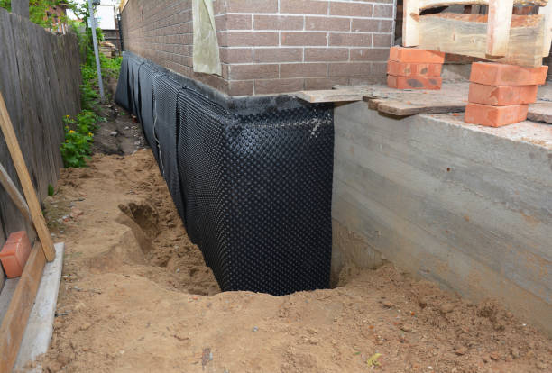 SJ Waterproofing Pros technician performing targeted Basement Waterproofing assessment in Union City, TN